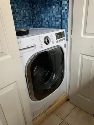 a washer and dryer in a small room at Tyrolean Village 6 2 Bedroom 1 and a Half Bath Sleeps 6 Walk to Lift Steps to town shuttle in Mammoth Lakes
