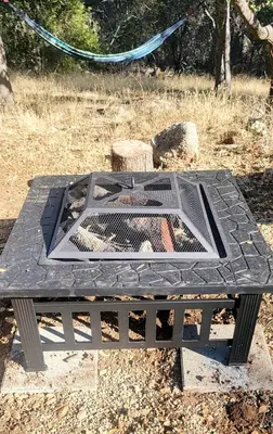 a black picnic table with a grill on it at Blue Mountainview in Mariposa