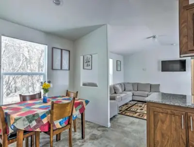 a kitchen and living room with a table and a couch at Blue Mountainview in Mariposa