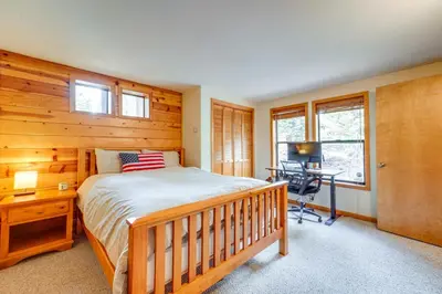 a bedroom with a bed and a desk at Deck with Hot Tub Serene Cabin in Truckee in Truckee