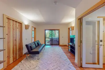 a living room with a couch and a television at Epic Mountain Escape in Tahoe Vista