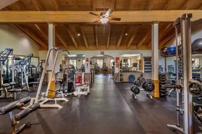 a gym with several treadmills and machines at Bright 2BDR Next to NorthStar - 5min Walk! in Truckee