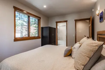 a bedroom with a bed and a window at Grayfox #4 3 Bedroom 3 Bathroom Sleeps 8 Walk to Village Gondola in Mammoth Lakes