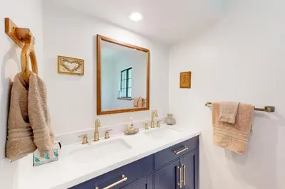 a bathroom with a sink and a mirror at Cozy and Comfortable Yosemite Portal in Oakhurst