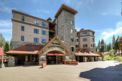 a large building with a tower on top of it at Powder Pines Retreat in Kingswood Estates