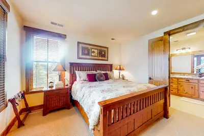 a bedroom with a large bed and a window at Lodges 1136 in Mammoth Lakes