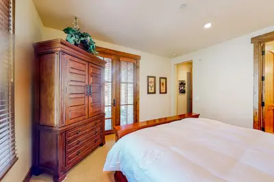 a bedroom with a large wooden dresser and a bed at Lodges 1136 in Mammoth Lakes