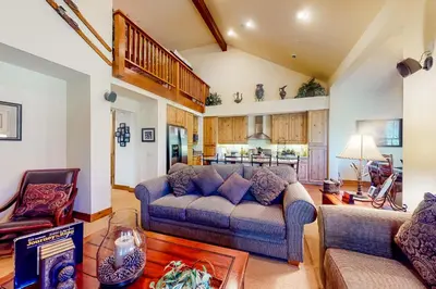 a living room with a couch and a table at Lodges 1136 in Mammoth Lakes