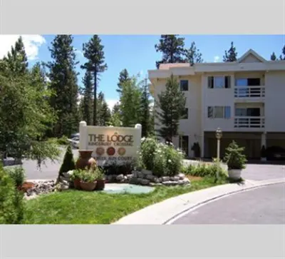 a building with a sign in front of a house at GetAways at the Lodge at Kingsbury Crossing in Stateline