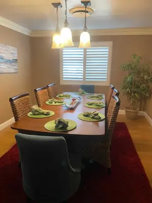 a dining room with a table with chairs and a dining room at Sequoia Basecamp with Hot Tub Oasis in Visalia