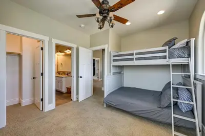 a bedroom with bunk beds and a ceiling fan at California Vacation Rental with Private Pool and Patio in Visalia