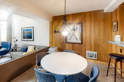 a living room with a white table and chairs at St Moritz 9 in Mammoth Lakes