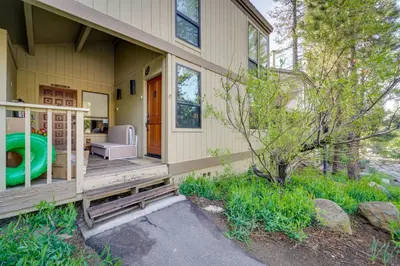 a porch of a house with a chair and a couch at Cozy Kings Beach Condo Near Lake Tahoe and Skiing in Kings Beach