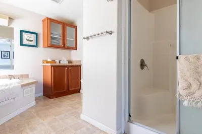 a bathroom with a shower and a sink at Mariposa Ridge Retreat in Mariposa