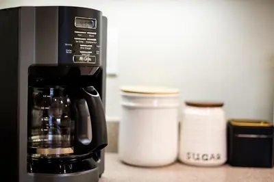 a coffeemaker and containers on a kitchen counter at Private condo steps from ski lift minutes to lake in Stateline