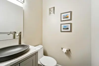 a bathroom with a sink and a toilet at 10 Mi to Palisades Tahoe! Condo with Game Room in Tahoe City