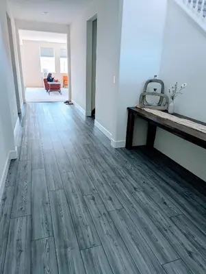 an empty living room with a wooden floor at Modern, Spacious & Relaxing Home in Sparks, NV in Sparks