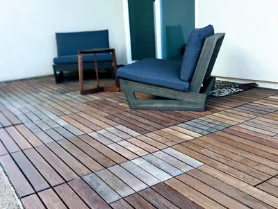 a blue chair sitting on top of a wooden floor at Modern, Spacious & Relaxing Home in Sparks, NV in Sparks