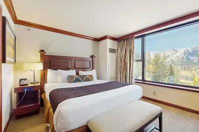 a hotel room with a bed and a large window at Resort at Everline Resort & Spa #558 in Olympic Valley
