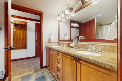 a bathroom with a sink and a large mirror at Resort at Everline Resort & Spa #560 in Olympic Valley
