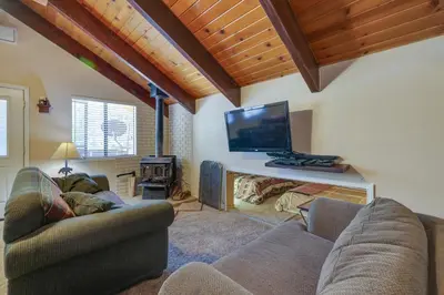 a living room with two couches and a flat screen tv at Pinecrest Dodge Ridge Cabin Shared Outdoor Space in Cold Springs