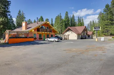 a building with a car parked in a parking lot at Pinecrest Dodge Ridge Cabin Shared Outdoor Space in Cold Springs