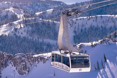 a ski lift with a picture of a mountain at 556 Everline in Olympic Valley