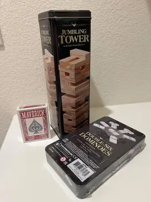 a book sitting on a table next to a box at Brand-New, Beautiful & Stylish Home in Sacramento! in Sacramento