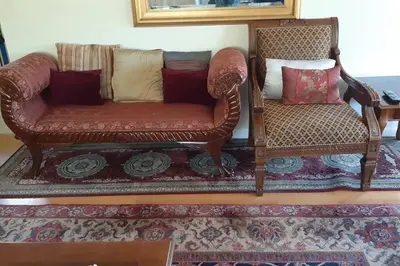 a couch and a chair in a living room at A Great Riverfront Retreat a Shangri-La Paradize in Valley Springs