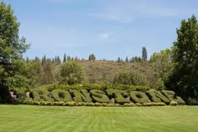 a garden with a circle of bushes in a field at A Great Riverfront Retreat a Shangri-La Paradize in Valley Springs