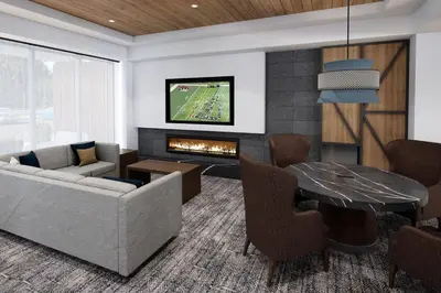 a living room with a couch and a fireplace at Staybridge Suites Manteca by IHG in Manteca