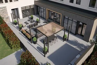 an overhead view of a patio with a table and benches at Staybridge Suites Manteca by IHG in Manteca