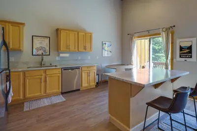 a kitchen with yellow cabinets and a counter top at Truckee Retreat with Fireplace and Community Amenities in Truckee