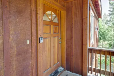 a wooden door on the side of a house at Truckee Retreat with Fireplace and Community Amenities in Truckee