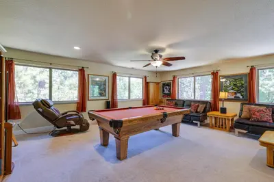 a living room with a pool table in it at Groveland Vacation Rental Near Pine Mountain Lake! in Groveland