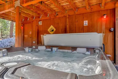 a hot tub in a room with snow on the walls at 3BR Tahoe Cabin in the Trees with Hot Tub in Carnelian Bay