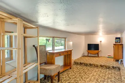 a room with a desk and a chair and a television at Groveland Vacation Rental about 26 Miles to Yosemite! in Groveland
