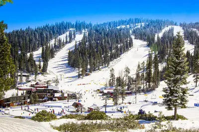 a ski slope with a ski lodge on a mountain at Rocky Point Paradise in Truckee