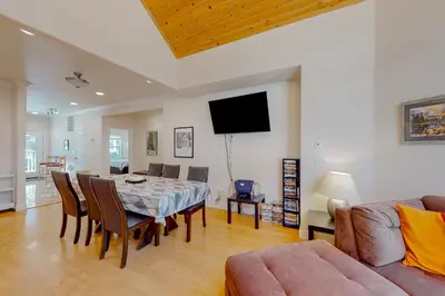 a living room with a dining room table and a couch at Granite Tranquility in Yosemite West