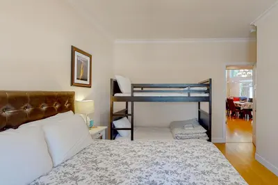 a bedroom with a bed and a bunk bed at Granite Tranquility in Yosemite West