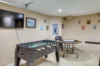 a ping pong table in a room with a table at Mi-Wuk Village Vacation Rental with Multi-Level Deck in Mi-Wuk Village