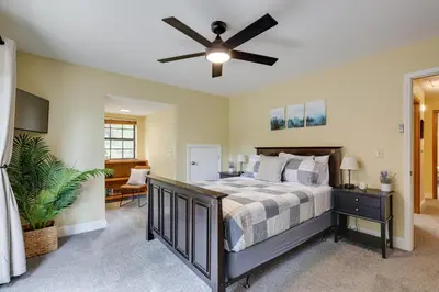 a bedroom with a bed and a ceiling fan at Mi-Wuk Village Vacation Rental with Multi-Level Deck in Mi-Wuk Village