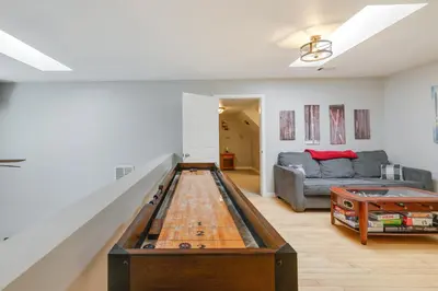 a living room with a table and a couch at Near Dtwn Twain Harte Home with Furnished Deck! in Twain Harte