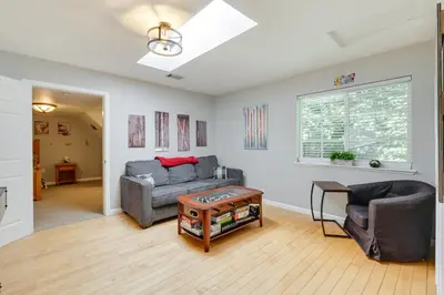 a living room with a couch and a table at Near Dtwn Twain Harte Home with Furnished Deck! in Twain Harte