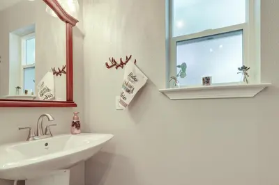 a bathroom with a sink and a mirror at Near Dtwn Twain Harte Home with Furnished Deck! in Twain Harte