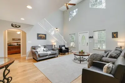 a living room with couches and a table at Near Dtwn Twain Harte Home with Furnished Deck! in Twain Harte