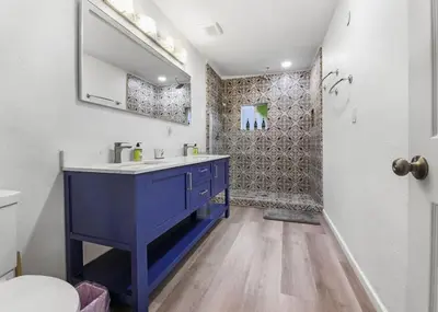 a bathroom with a blue sink and a shower at Sequoia Studio with Private Patio in Visalia