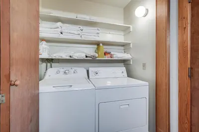 a laundry room with a washer and dryer at Deck and Gas Grill Secluded Arnold Cabin Rental! in Arnold