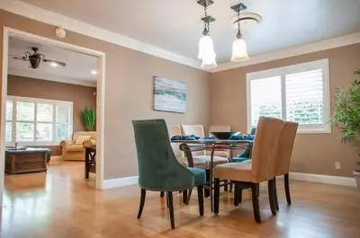 a dining room with a table and chairs at Group Retreat with Hot Tub & Studio in Visalia