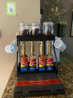 a rack of bottles of beer on a counter at Group Retreat with Hot Tub & Studio in Visalia